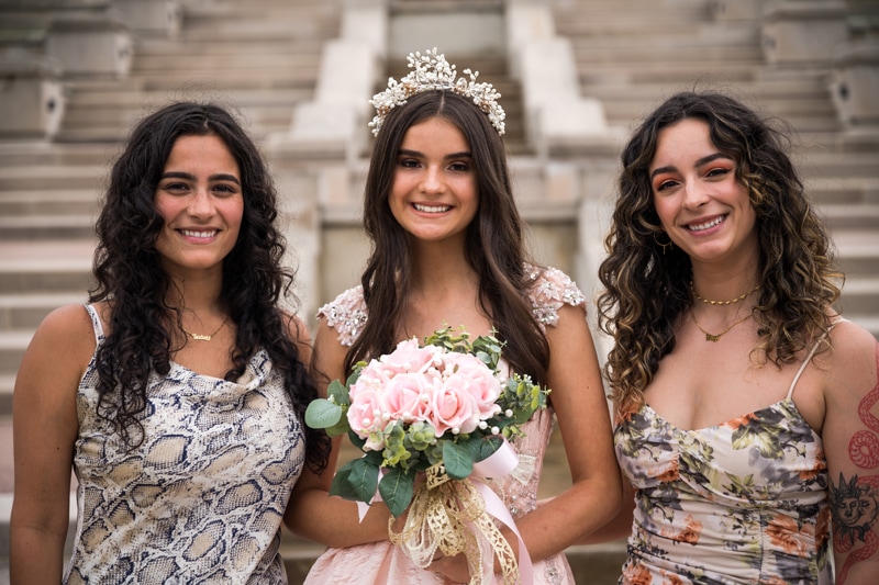 Family Photographer, a bride stands near her sister bridesmaids at her wedding