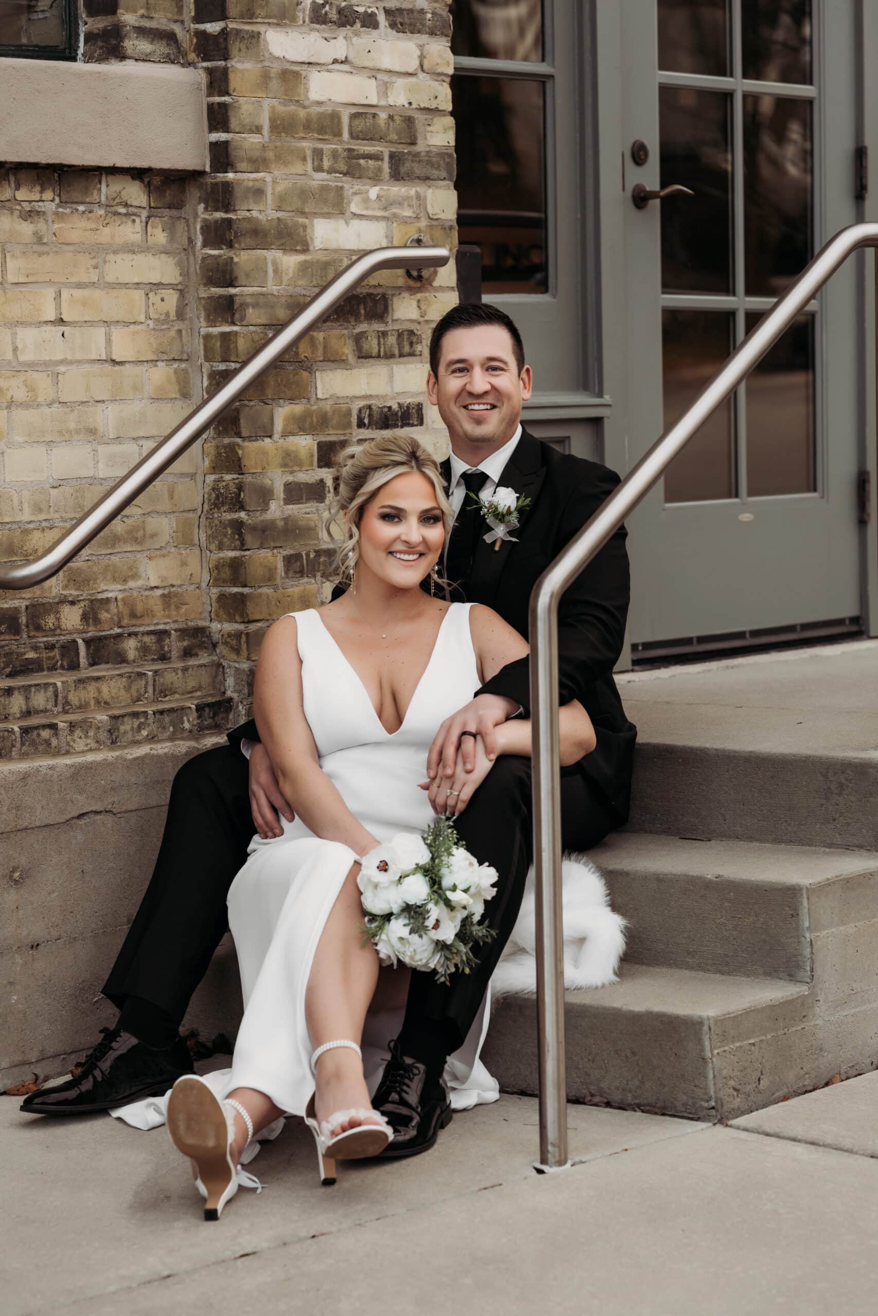 Wedding & Elopement Photography, bride and groom sitting on stairs