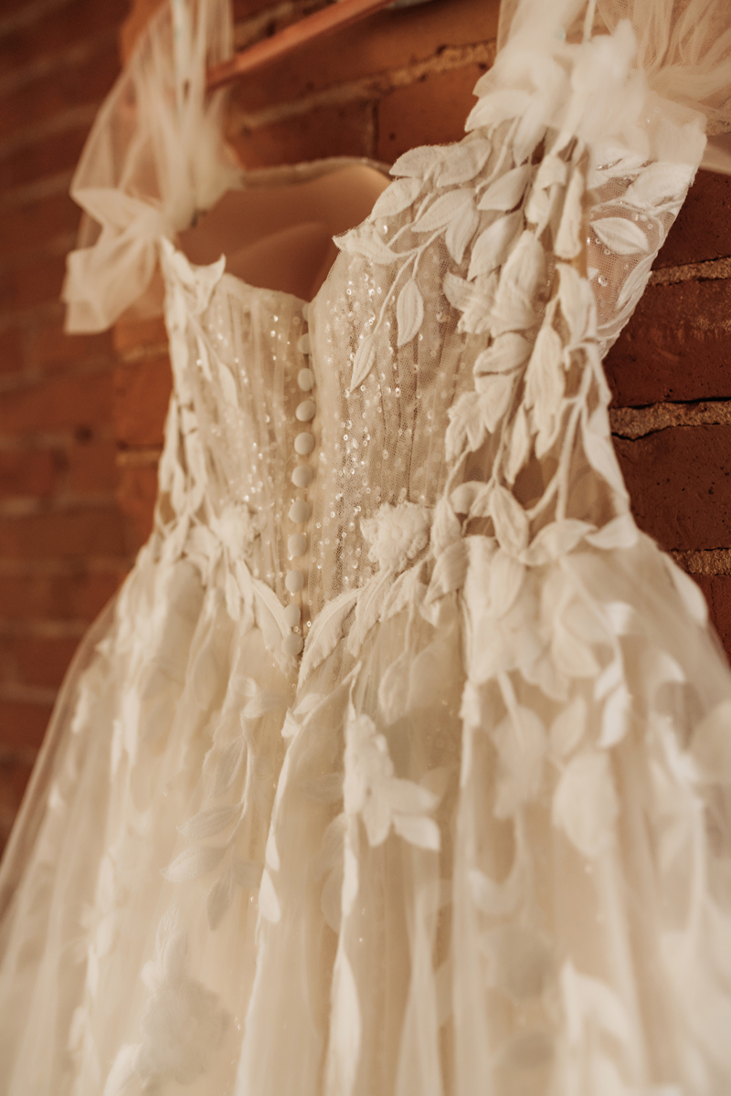 Wedding & Elopement Photography, detail shot of brides dressing hanging up