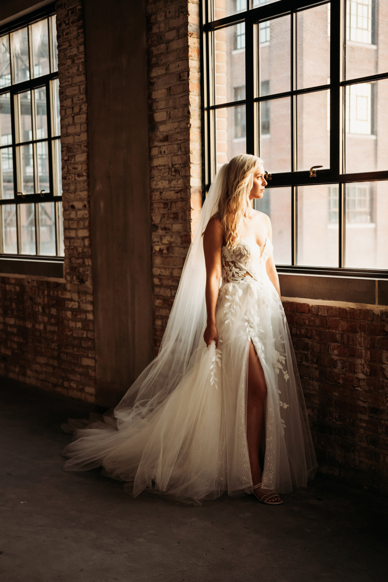 Wedding & Elopement Photography, Bride standing by window looking outside