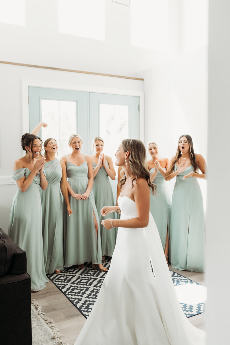 Wedding & Elopement Photography, bridesmaid cheering for bride during her getting ready