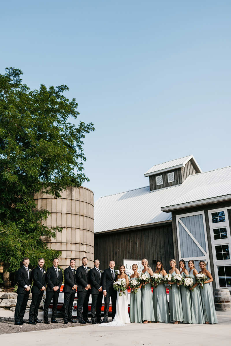 Wedding & Elopement Photography, bridal party lined up outside of an old silo
